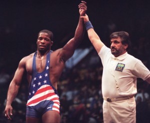 Kerry McCoy of the US hand is raised by an unident