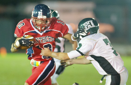 Football: It's all red under the lights at Miller Place