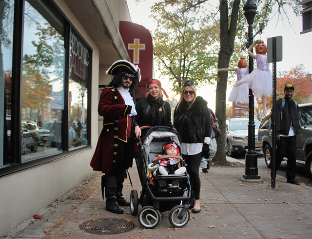 Little Caden Jarrett (boy in stroller) with his pirate crew: father Cory Jarrett (of Medford), mother Monica Fernandez (of Medford), and grandmother Ileana Giambone (of Southampton).