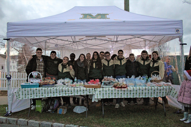 The Bishop McGann-Mercy Diocesan High School Crew Team raising money with a holiday bake sale . (Credit: Elizabeth Wagner)