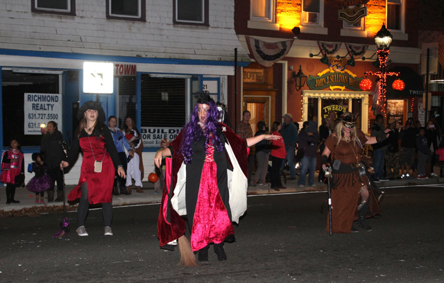 Diane Tucci and fellow Witch Doctors perform a ritualistic dance with their dancing sticks.
