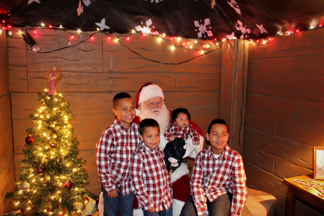 The Gilliam Brothers in matching Christmas outfits – they were the first family to visit with Santa. (Credit: Elizabeth Wagner)