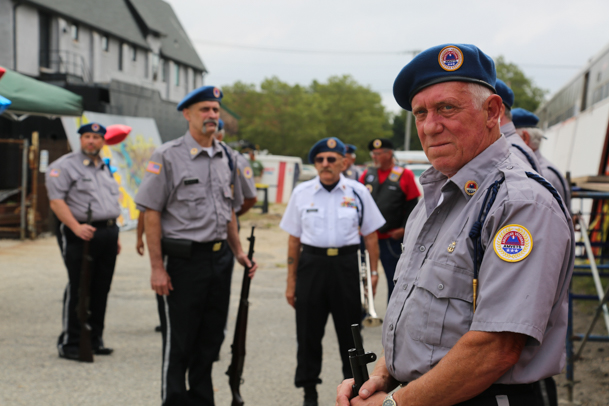 Members of the Amvets prepare for the 21-gun salute