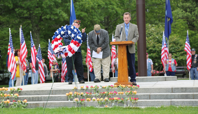 Riverhead Town Supervisor Sean Walter addresses the crowd at Calverton National Cemetery Monday. (Credit: Grant Parpan)