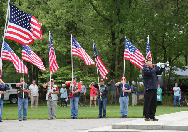 'Taps is performed by Greg Efimetz of North Shore Community Band. (Credit: Grant Parpan)