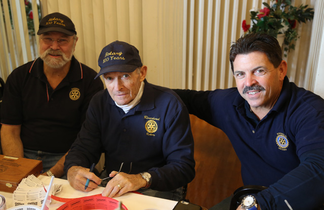 Rotarians Ken Zahler (from left), Murray Schneps and Tom Carson sell raffle tickets.