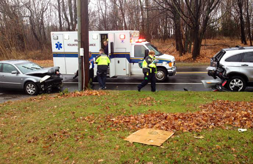 RACHEL YOUNG PHOTO | Two people were taken to Peconic Bay Medical Center Wednesday morning after a sedan rear-ended an SUV in Aquebogue.