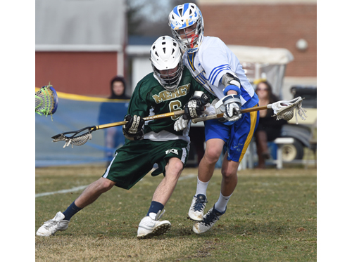Mercy's Louis Arrester tries to check Mattituck middie Joe Bartolotto. (Credit: Robert O'Rourk)