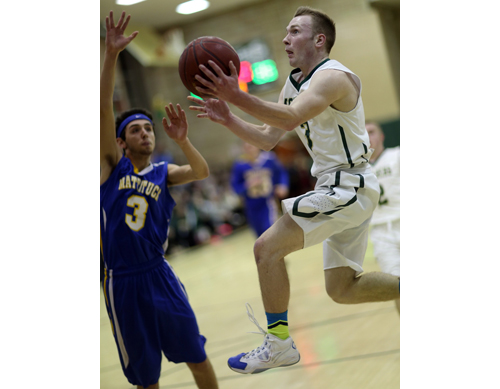 Bishop McGann-Mercy's Joe Jeskie attacking the basket while Mattituck's Parker Tuthill defends. (Credit: Garret Meade)