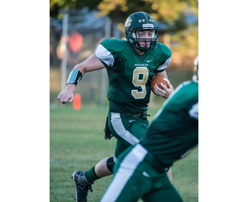 Bishop McGann-Mercy quarterback Kevin Santacroce looks for running room against Elwood/John Glenn's defense. (Credit: Robert O'Rourk)