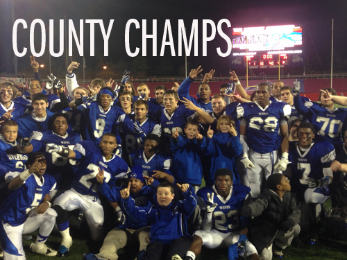 JOE WERKMEISTER PHOTO | The Riverhead Blue Waves celebrate their second straight Division II county championship Friday night after a thrilling 21-14 win over East Islip at Stony Brook University.