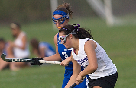 Brewer GARRET MEADE PHOTO | Greenport's Jackie Esposito moves the ball up field against Riverhead's Christy Brewer, who scored the game-winning goal in penalty strokes after the game ended scoreless.