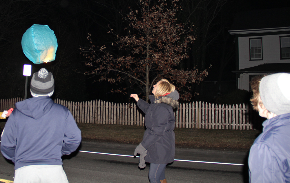 Windy conditions did not get in the way of Ms. Callaghan's plan to light lanterns in his honor.