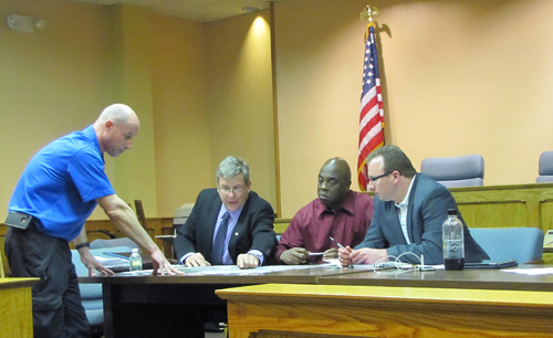 Chris Nentwich of Aquebogue discusses sports fields with Councilman George Gabrielsen and recreation advisory committee members Larry Williams and Brian Mills Monday. (Credit: Tim Gannon)
