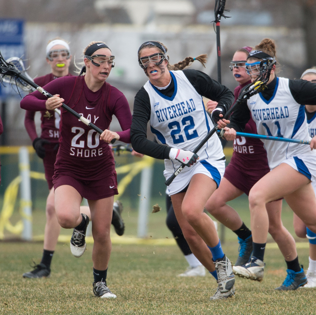 Riverhead senior Courtney Troyan is guarded by Bay Shore senior Kendra Cronin Thursday. (Credit: Robert O'Rourk)