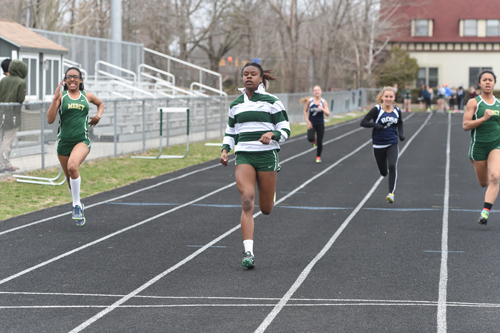 McGann-Mercy senior Danisha Carter cruises across the finish line in the 100-meter dash. (Credit: Robert O'Rourk)