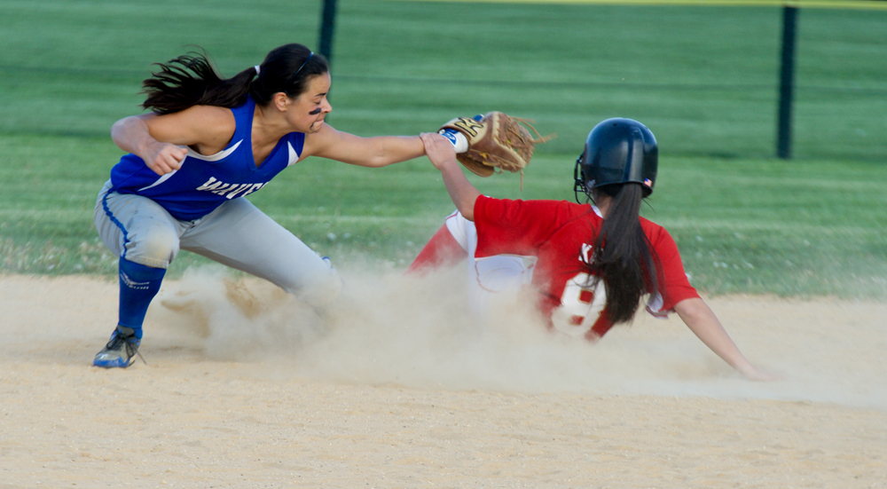 Riverhead shortstop Dani Napoli applies a tag on Hills West senior Samantha Katz. (Credit: Robert O'Rourk)