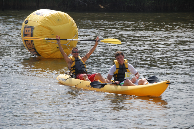 Two racers celebrate at the Paddle Battle Saturday afternoon. (Credit: Vera Chinese)