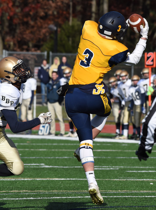 Wildcats receiver Daniel Cassidy goes up for a catch in the first quarter.