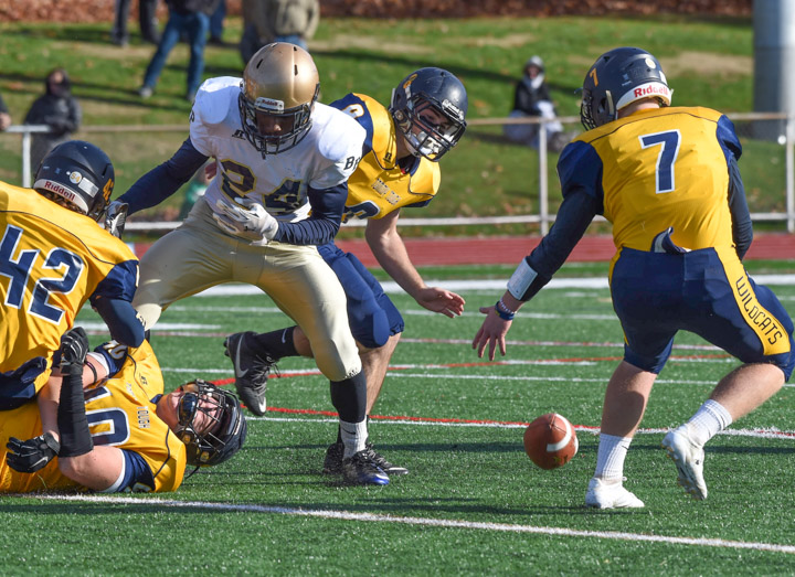 Wildcats Will Loper (42) and Ethan Wiederkehr both tackled Ka’Sean Watlington, who fumbled on the play. Kevin Cutinella recovered the ball for SWR.
