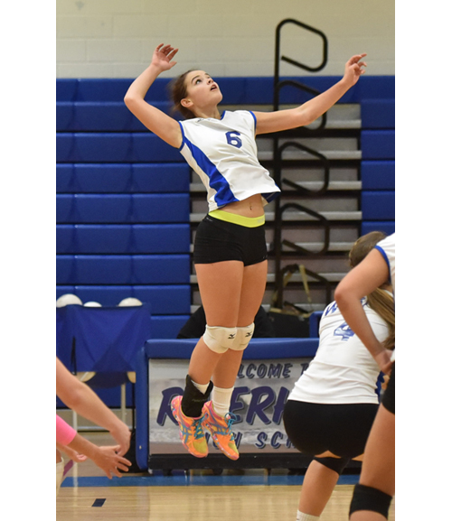 Riverhead senior Rachel Doroski rises up for a hit in Friday's match against Smithtown West. (Credit: Robert O'Rourk)