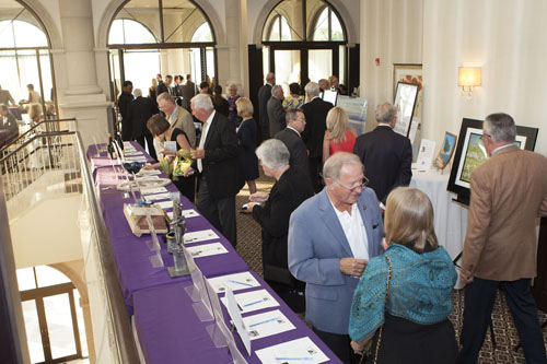 Studying the items up for auction. (Credit: Katharine Schroeder)