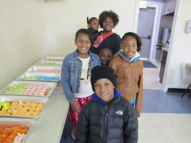 Tyre Lodge Conductress Theodora Midgette, in the back, checking out the cupcakes with youngsters Zehki Stephens, Zhirin Stephens (hidden in the middle), Anariynan Williams, Preston Gamble and Egypt Dozier at Saturdays's Easter Egg hunt.
