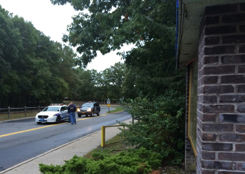 Suffolk police and school security at the entrance to Shoreham-Wading River High School, where the media waited outside this morning. (Credit: Grant Parpan)