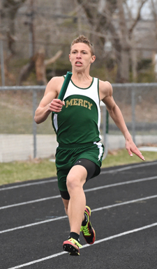 McGann-Mercy senior Alex Fabrizio carries the baton to finish the 4 x 100 relay. (Credit: Robert O'Rourk)