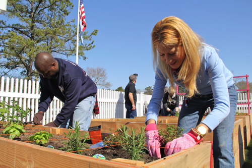 Southampton Councilwoman Christine Scalera planting herbs Saturday morning.