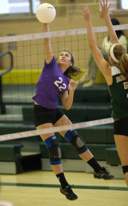 GARRET MEADE PHOTO | Greenport/Southold's Marina DeLuca swinging at the ball while Bishop McGann-Mercy's Fiona Nunez attempts a block.