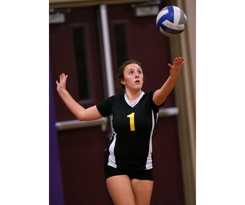 Sam Henry, one of Greenport/Southold's eight seniors, prepares to serve. Henry made 13 digs against Bishop McGann-Mercy. (Credit: Garret Meade)