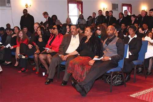 BARBARAELLEN KOCH PHOTO | Demitri Hampton's family in the front row: (from right) brother Jamal Davis, parents Juanita and Theodore 'Teddy' Trent, and sister Jennifer Davis.