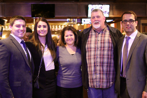 Family friends of Coach Lawrence (from left) Erik and Meaghan Howard, Lisa and Tim Hubbard, and Zachary Riyaz.