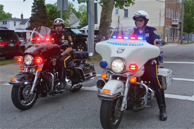Riverhead Highway Patrol Officer Dennis Cavanaugh (right) was last year's honored guest and led the march Friday morning. (Credit: Barbaraellen Koch)