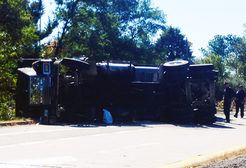 RACHEL YOUNG PHOTO | A tractor trailer carrying gravel crashed an LIE exit ramp Tuesday, the second 18-wheeler accident that morning.