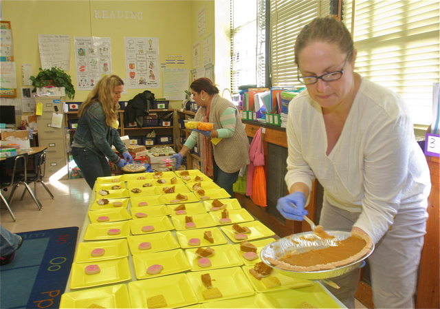 Christine Van de Wetering dishes out the pumpkin pie. (Credit: Barbaraellen Koch)