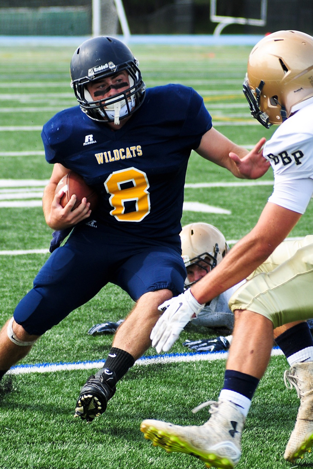 Shoreham-Wading River running back Chris Rosati carries the football in Saturday's win. (Credit: Bill Landon)