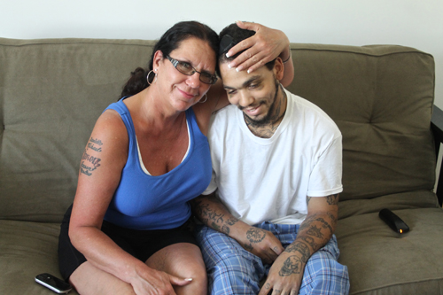 Aaron Hartmann, joined by his mother Linda, returned home last June after three weeks of treatment following a hit-and-run crash. (Credit: Paul Squire file)