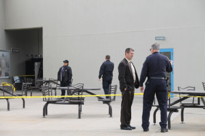 PAUL SQUIRE PHOTO | Riverhead police officers investigate where a woman was allegedly attacked at Tanger Outlet Center Tuesday afternoon.