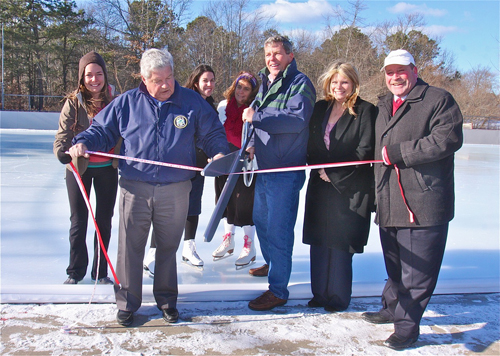 BARBARAELLEN KOCH PHOTO | Town board members (from left) John Dunleavy, George Gabrielsen, Jodi Giglio and Jim Wooten officially open the rink Thursday afternoon.