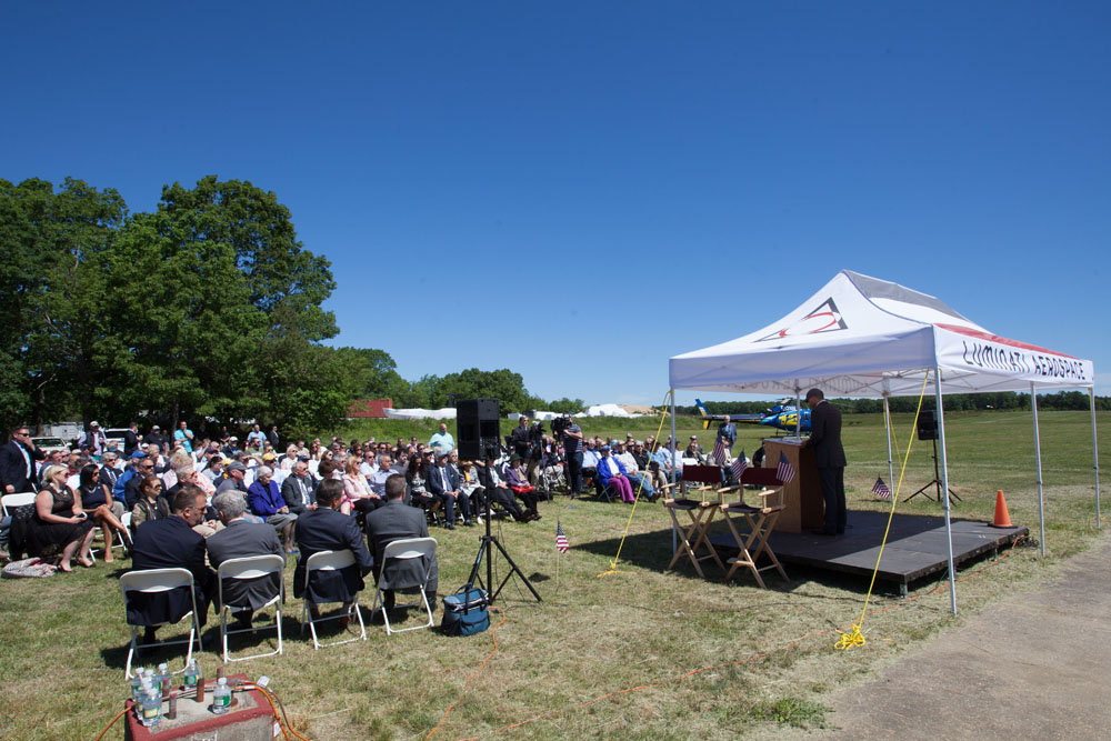 The crowd listens to the speakers before the demonstration begins. (Credit: Katharine Schroeder)