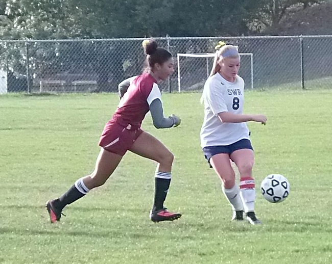 Shoreham-Wading River senior Mackenzie Roberts looks for a shot against Southampton Monday. (Credit: Joe Werkmeister)