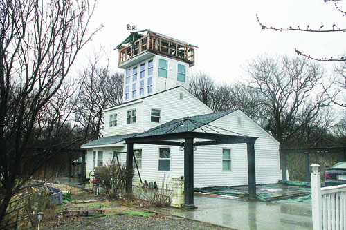 PAUL SQUIRE PHOTO | The widow's walk-type structure atop a Calverton home is teh start of a grand plan to match an 8,500-square-foot South Fork mansion.