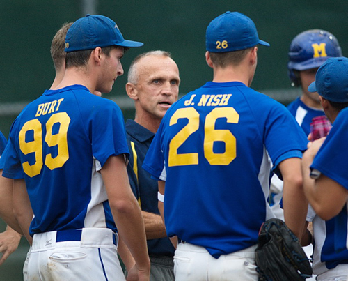 GARRET MEADE PHOTO | Mattituck Ospreys manager John Tardif confers with his players, including Cameron Burt and James Nish.