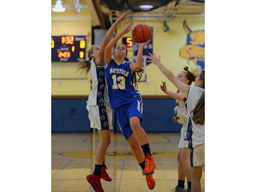 DANIEL DE MATO PHOTO | Shoreham-Wading River's Courtney Clasen was unable to block this shot by Mattituck's Liz Dwyer in the first quarter, but Clasen finished with the game with 9 blocks.