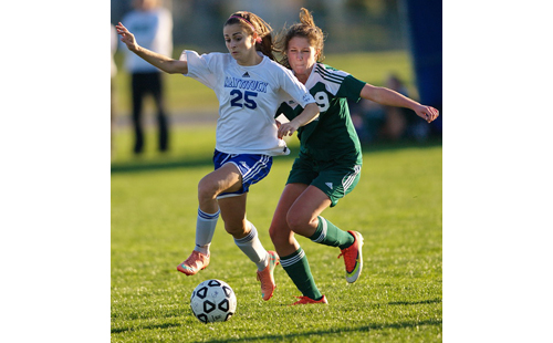 GARRET MEADE PHOTO | Ayla Ayoub, who scored her first career hat trick for Mattituck, races to the ball with Bishop McGann-Mercy's Ali Hulse.