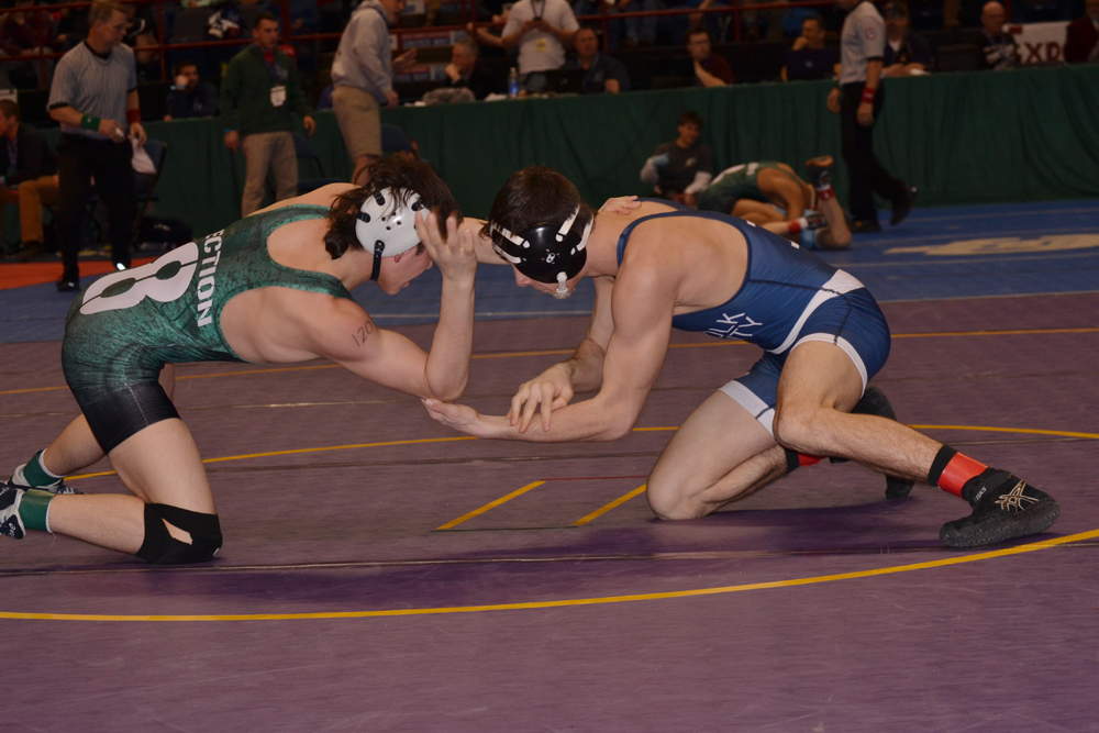 Riverhead senior Ed Matyka wrestles Peter Pappas of Plainview in the first round Friday of the state championship. (Credit: Paul Wager)