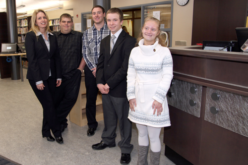 Media specialist Kim McGurk with her student interns, from left to right: Steven Chastaine, Tyler Allen, Matthew Card and Taylor Schumacher.