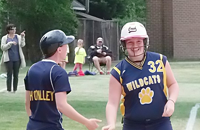 Shoreham-Wading River catcher Melissa Marchese was all smiles after clearing the bases with a triple in the first inning. (Credit: Joe Werkmeister)
